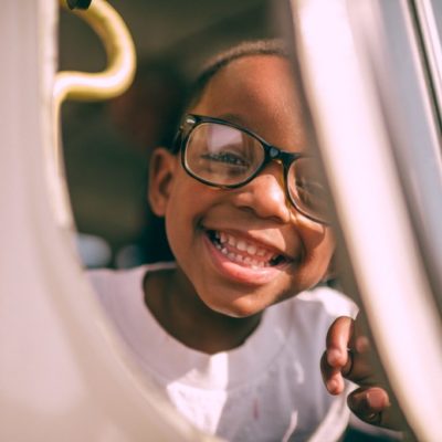 boy taking picture on window